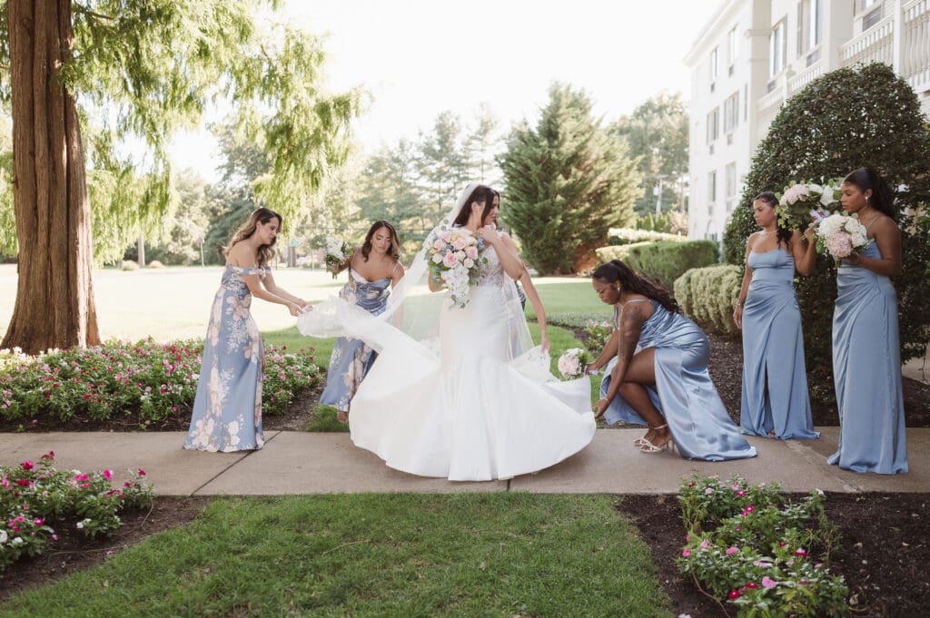 bridesmaids helping the bride on wedding day
