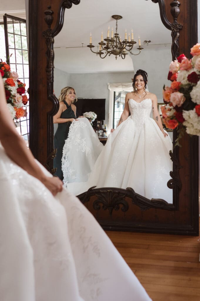 maid of honor on wedding day helping bride