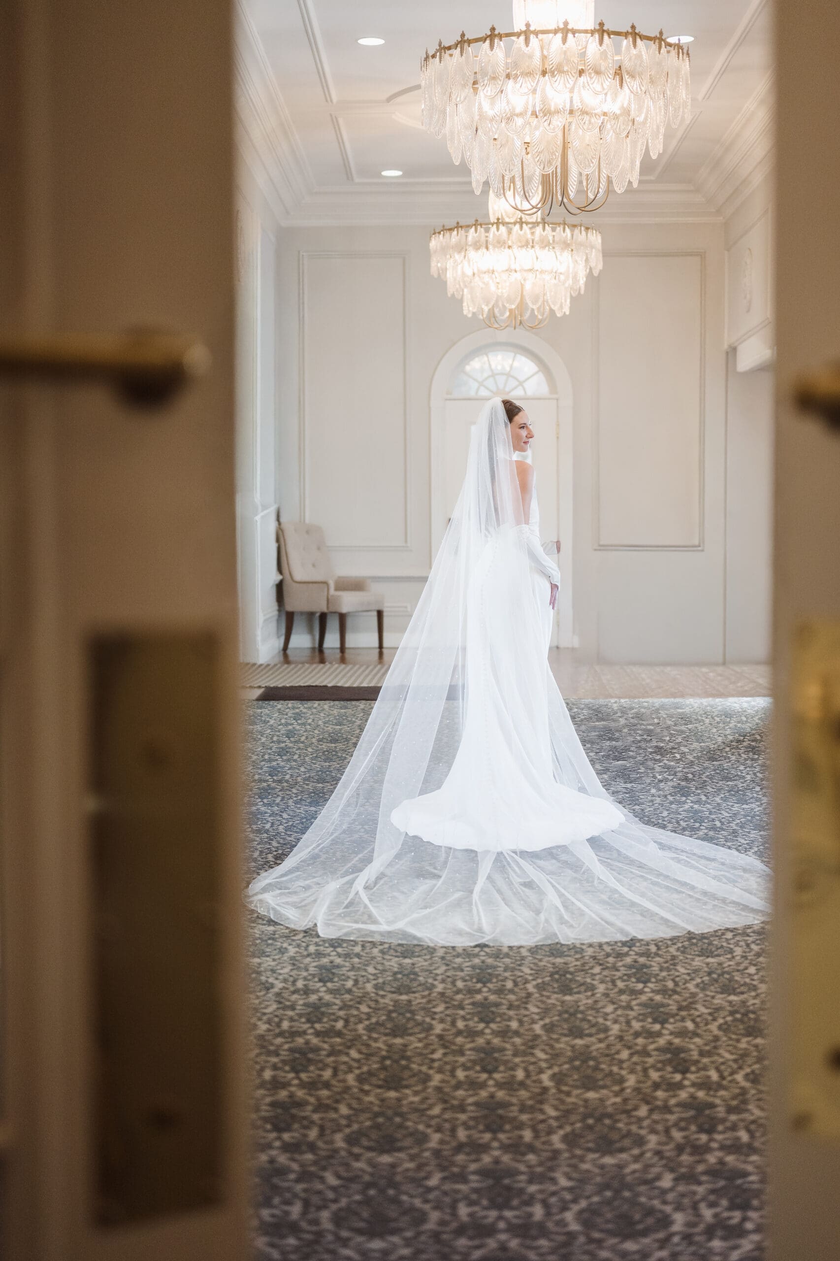 whimsical bridal portrait at the madison hotel doorway