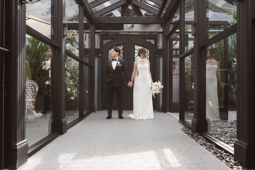 the glass hallway at the park loft for wedding photos