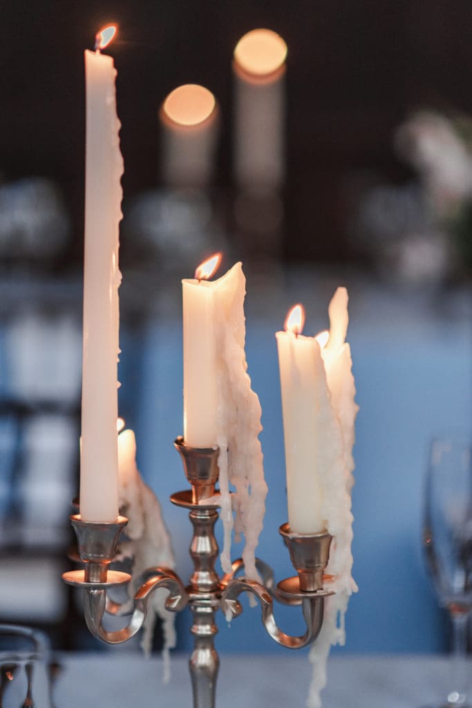 candelabras-lit-at-wedding