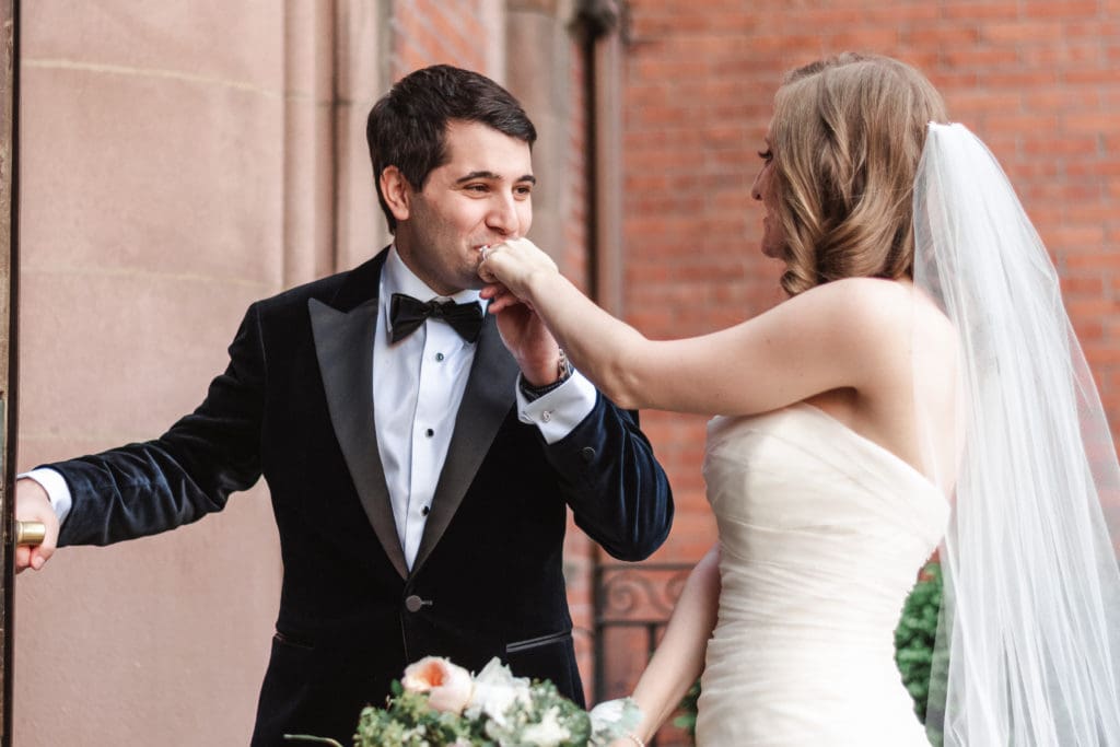 groom-kiss-bride-hand-at-highline-hotel-nyc-wedding-venue-by-suessmoments