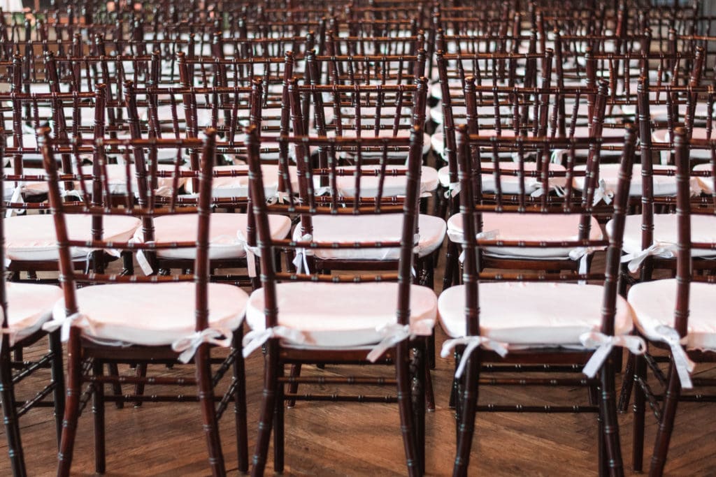 chairs-at-wedding-brown-with-white-cushions