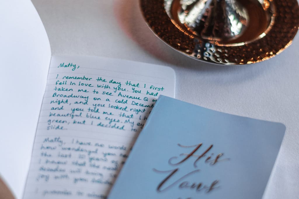 his-and-her-vows-book-at-wedding-day
