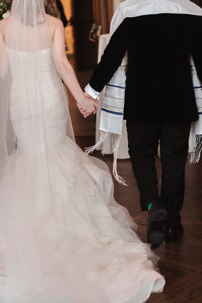 bride-and-groom-holding-hands