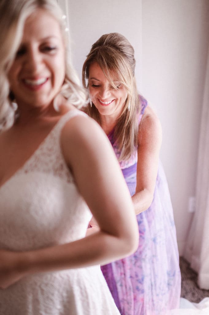 mother-of-bride-helping-with-dress-photo