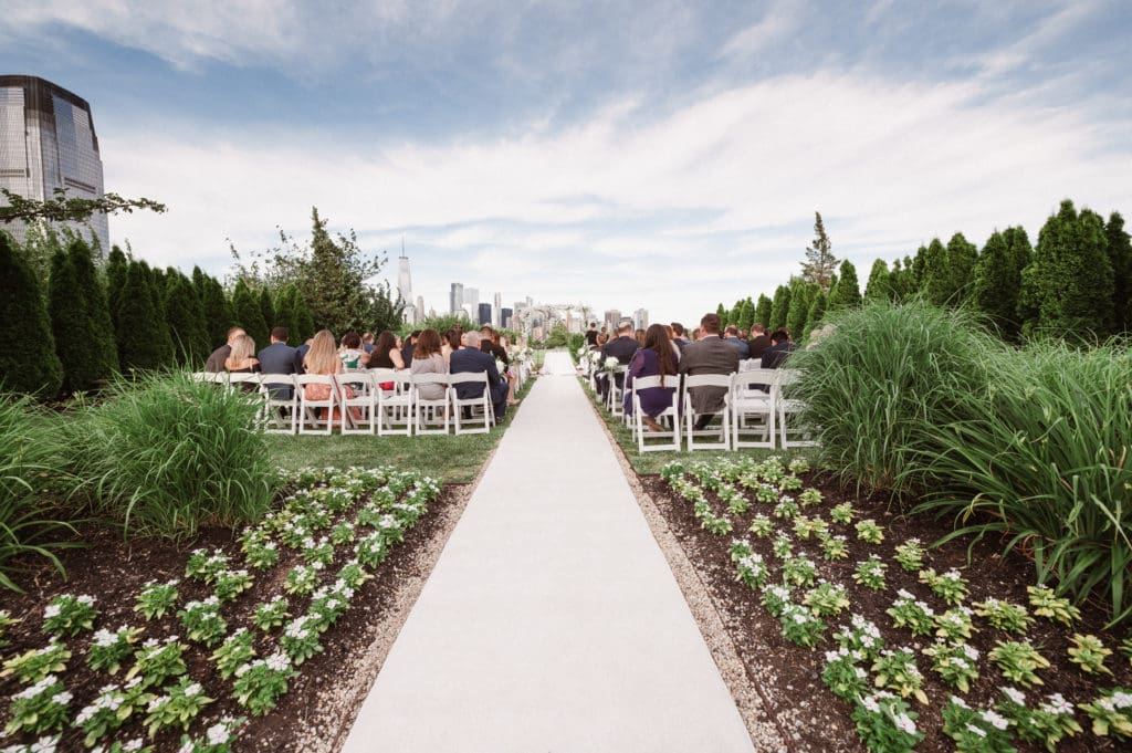outdoor-ceremony-with-nyc-skyline-views-at-liberty-house-restaurant-new-jersey-by-suessmoments