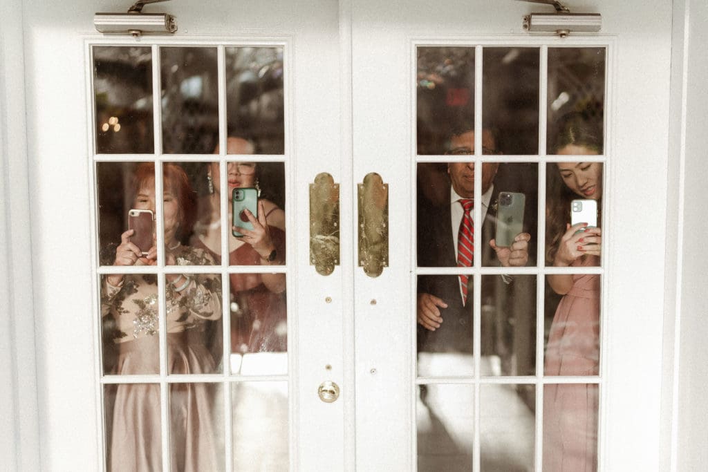bridal-party-looking-through-the-doorway