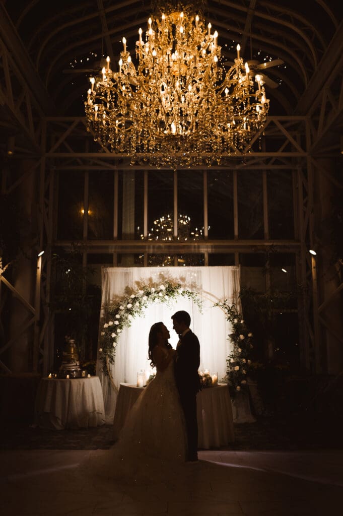 silouhette-back-lit-wedding-photo-with-chandelier