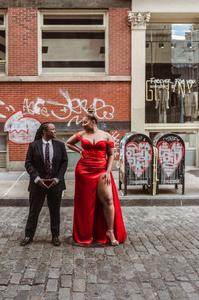 soho-nyc-engagement-photos-iconic-red-dress-couple-lesbian-lgbqt-photography-nyc-suess-moments