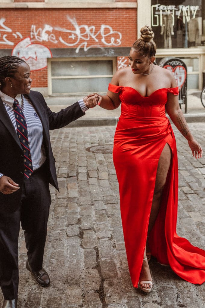 soho-nyc-engagement-photos-iconic-red-dress-couple-lesbian-lgbqt-photography-nyc-suess-moments