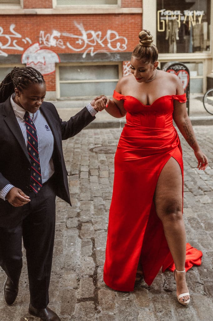 soho-nyc-engagement-photos-iconic-red-dress-couple-lesbian-lgbqt-photography-nyc-suess-moments