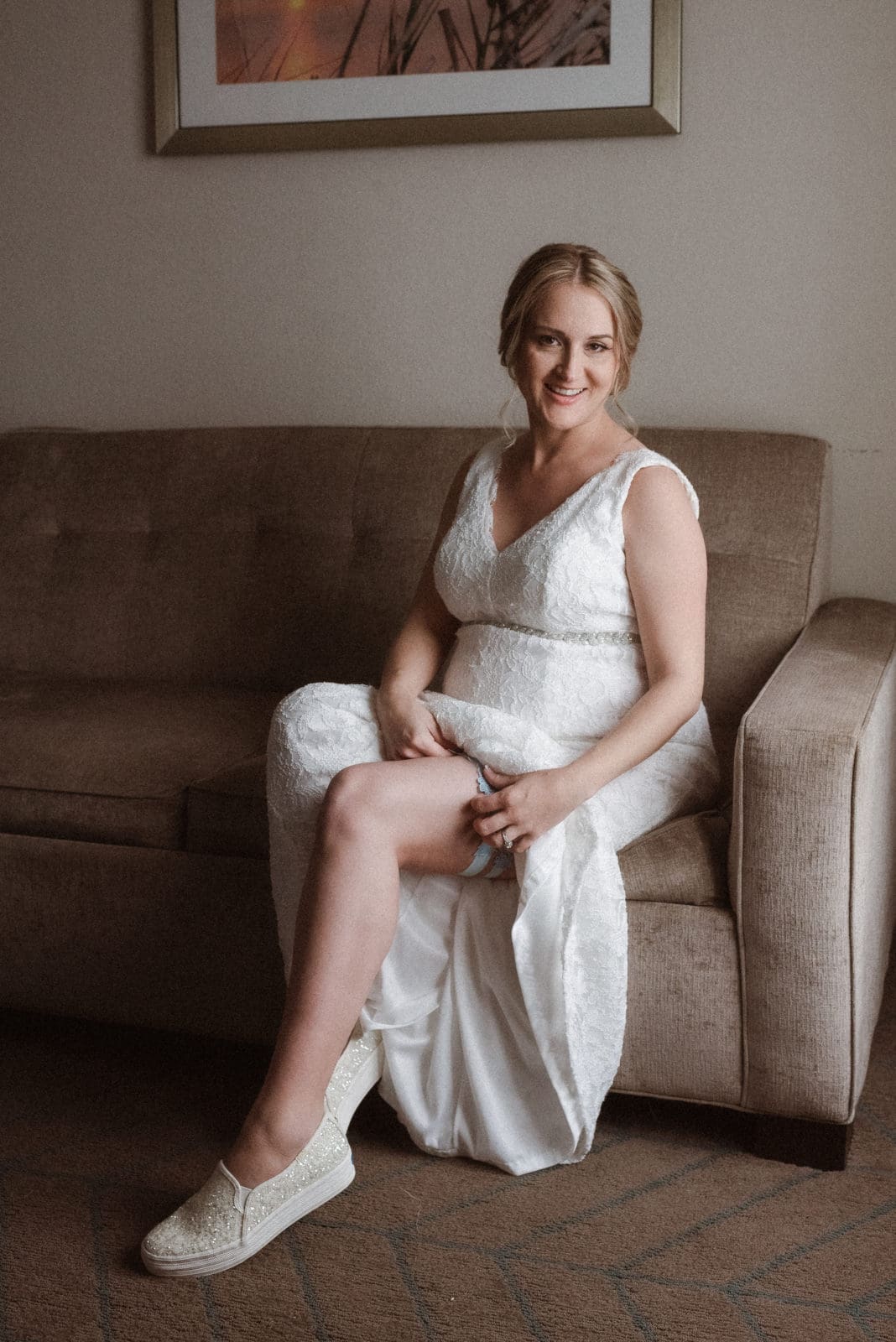 pregnant-bride-putting-on-garter-belt