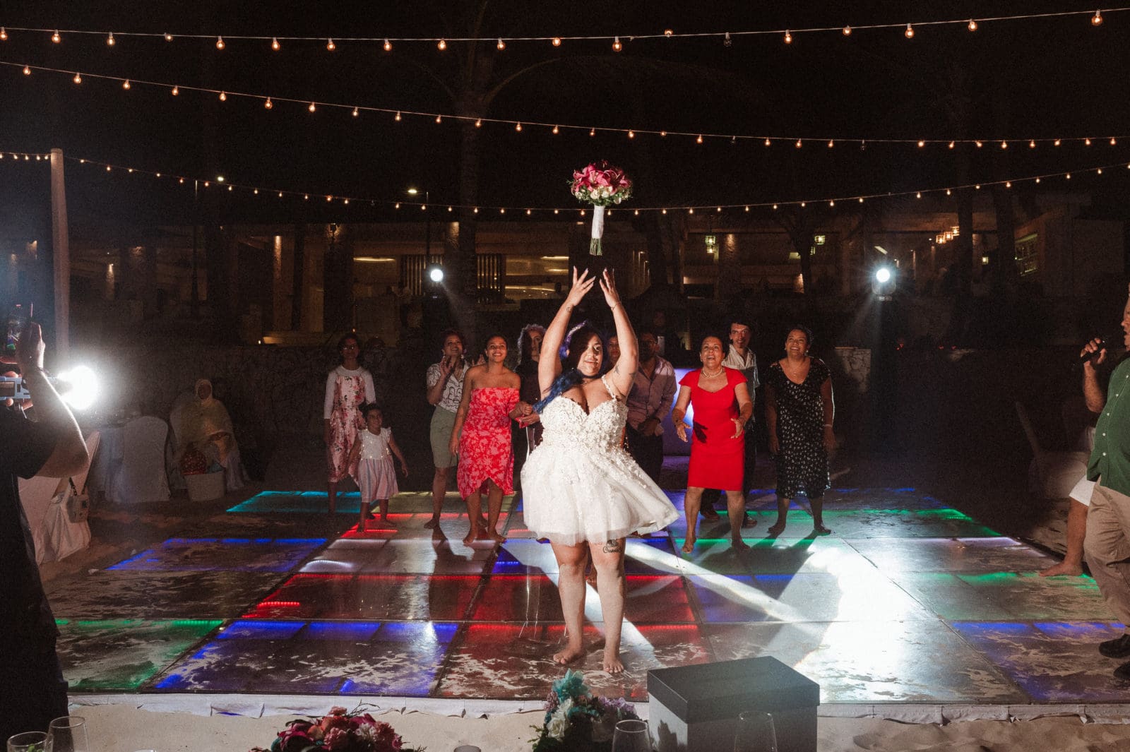 bouquet-toss-at-wedding-reception