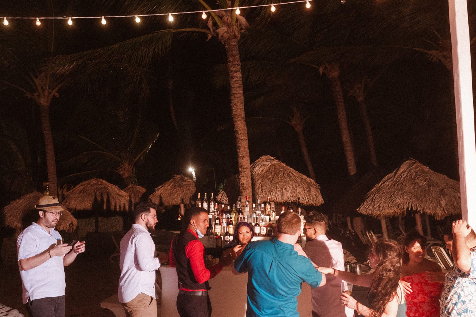 bride-pretending-bartender-at-wedding-reception