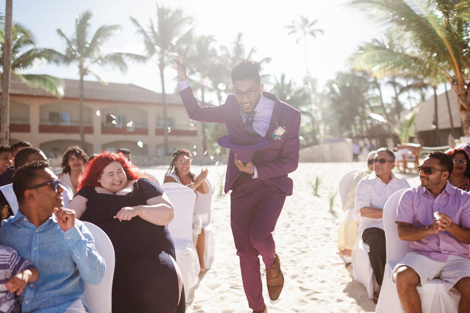 fun-flower-boy-coming-down-aisle-tossing-flowers-by-suessmoments