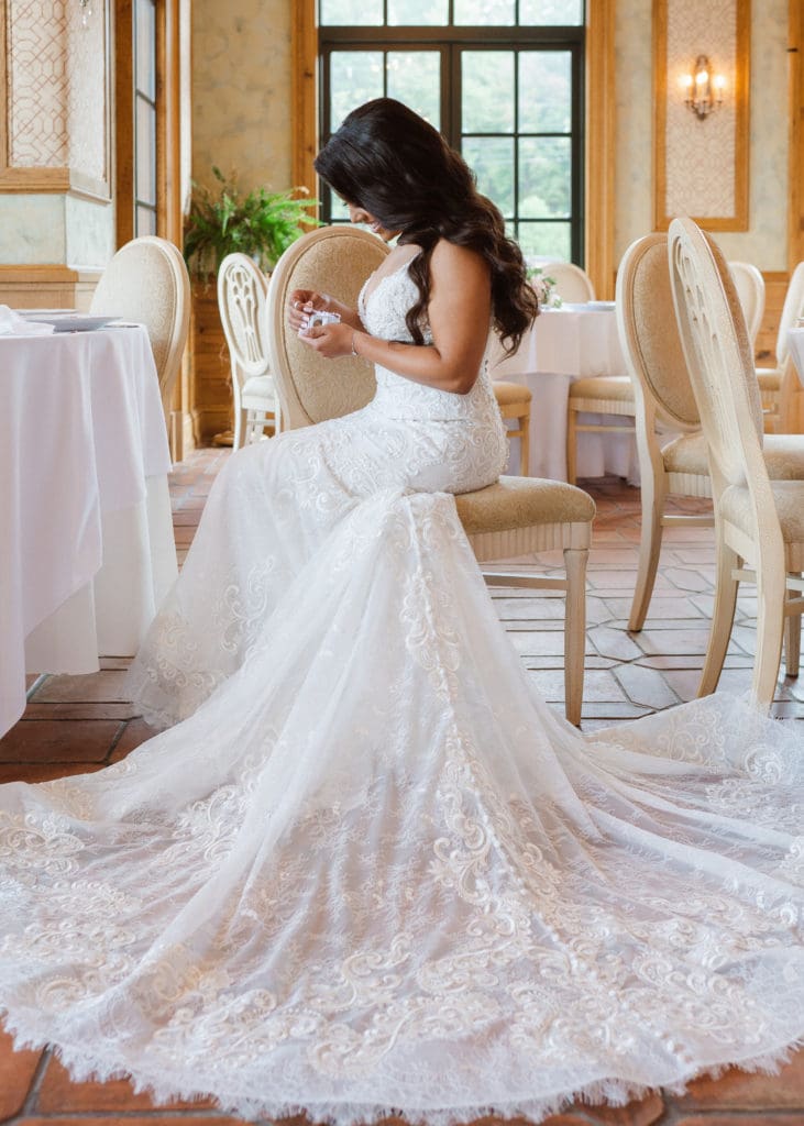 bride-opening-gift-from-groom-at-the-manor-weddings-nj