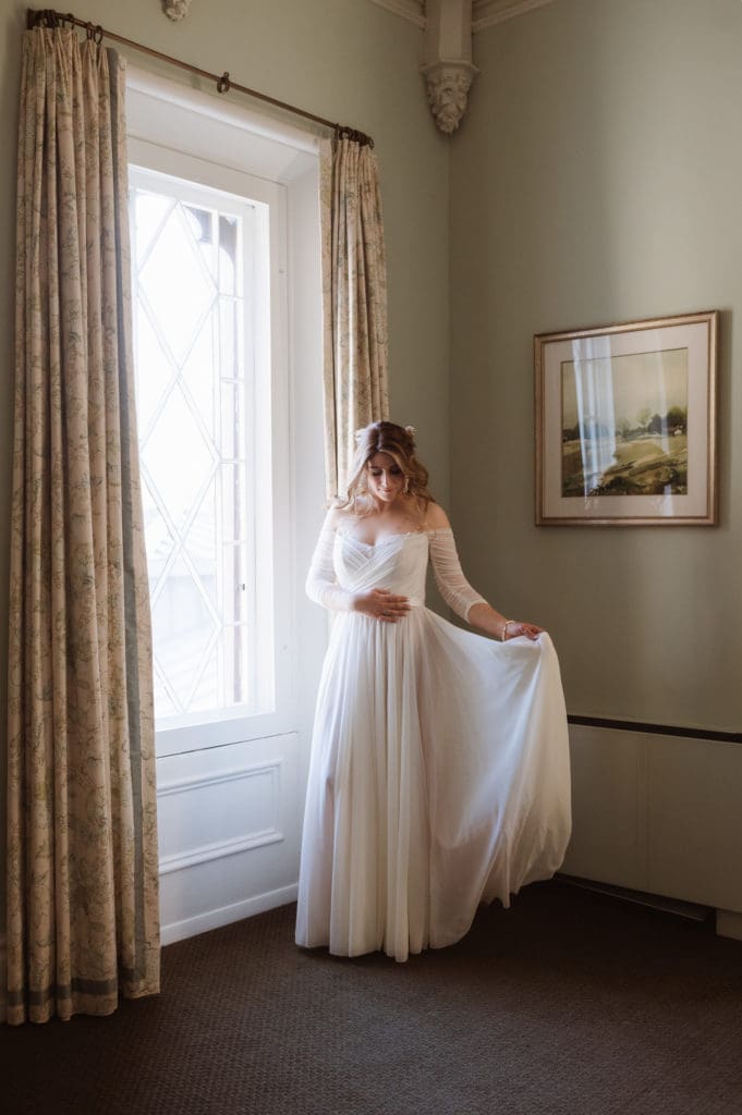 winter-wedding-at-whitby-castle-bride-portrait-suess-moments-wedding-photographer