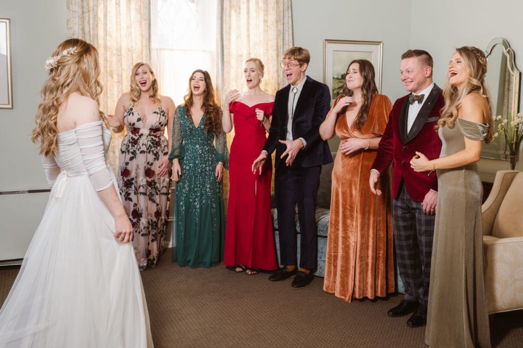first-look-with-bridesmaids-suess-moments-wedding-photographer