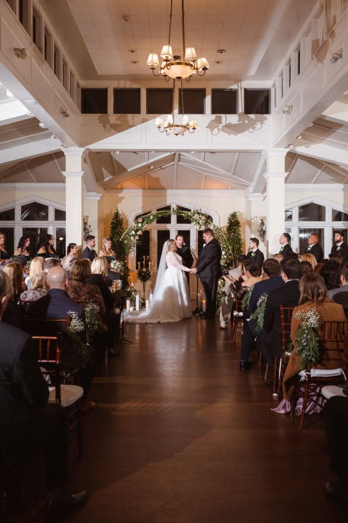 indoor-wedding-ceremony-at-the-whitby-castle-rye-new-york-by-suess-moments