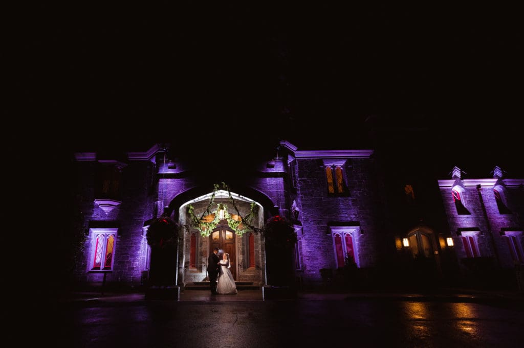 night-time-whitby-castle-photo-of-bride-and-groom