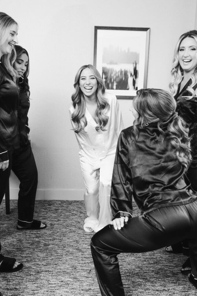 bridesmaids-having-fun-with-bride-on-wedding-morning