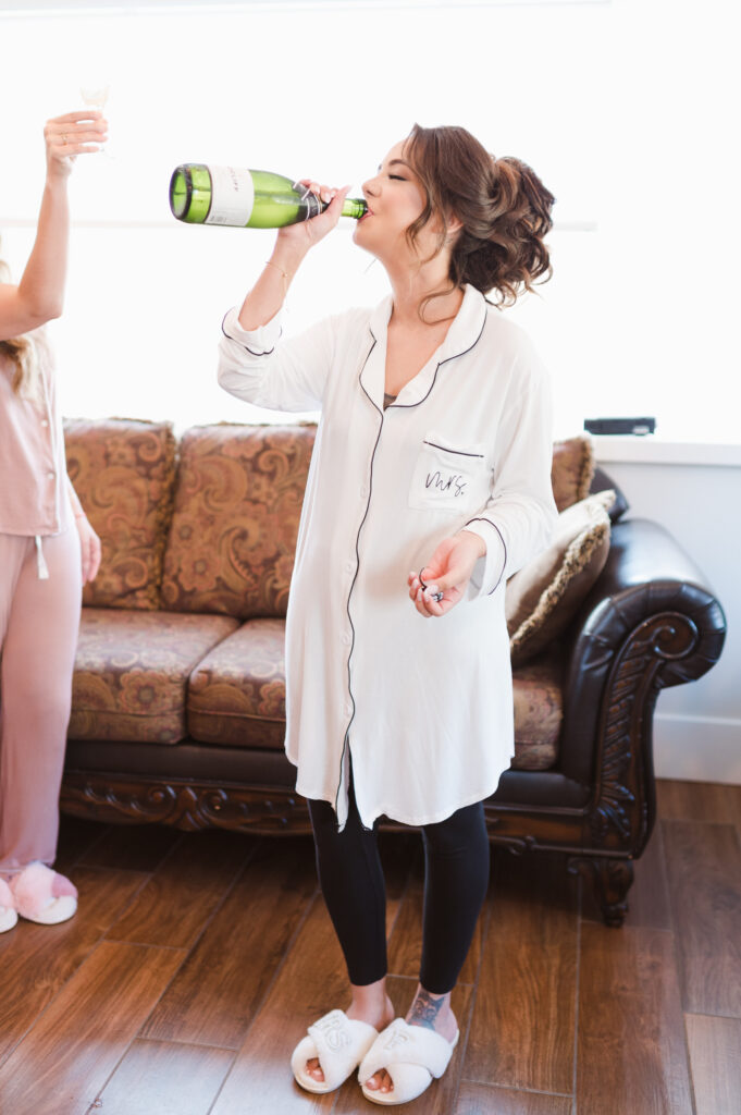 bride-drinking-champagne-photo