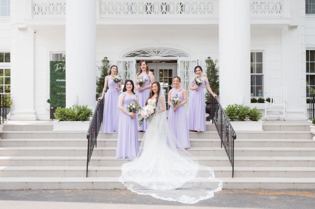 bridesmaids-on-steps-at-the-briarcliff-manor-ny-wedding-photos