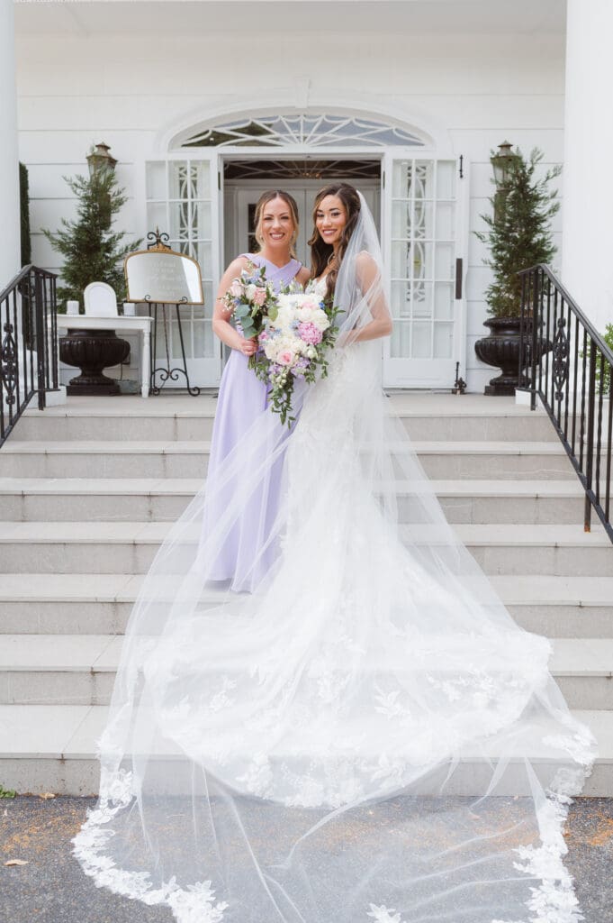 bridesmaids-on-steps-at-the-briarcliff-manor-ny-wedding-photos