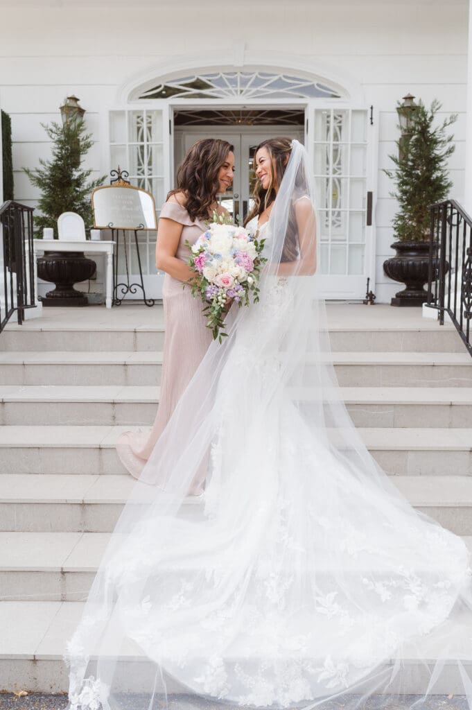 bridesmaids-on-steps-at-the-briarcliff-manor-ny-wedding-photos