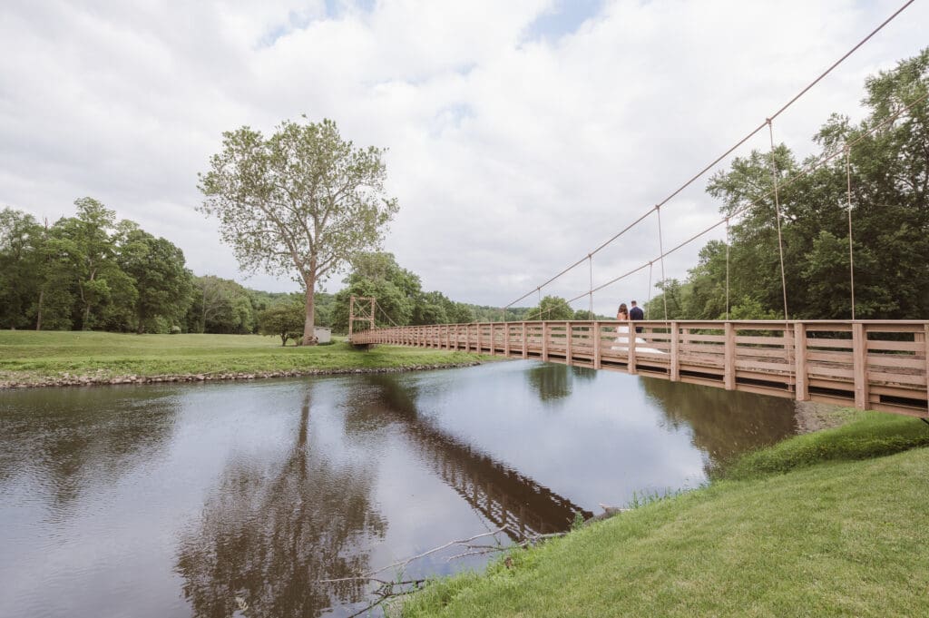 walking-the-bridge-west-hills-country-club-wedding-photos-by-suess-moments-nj-photographer