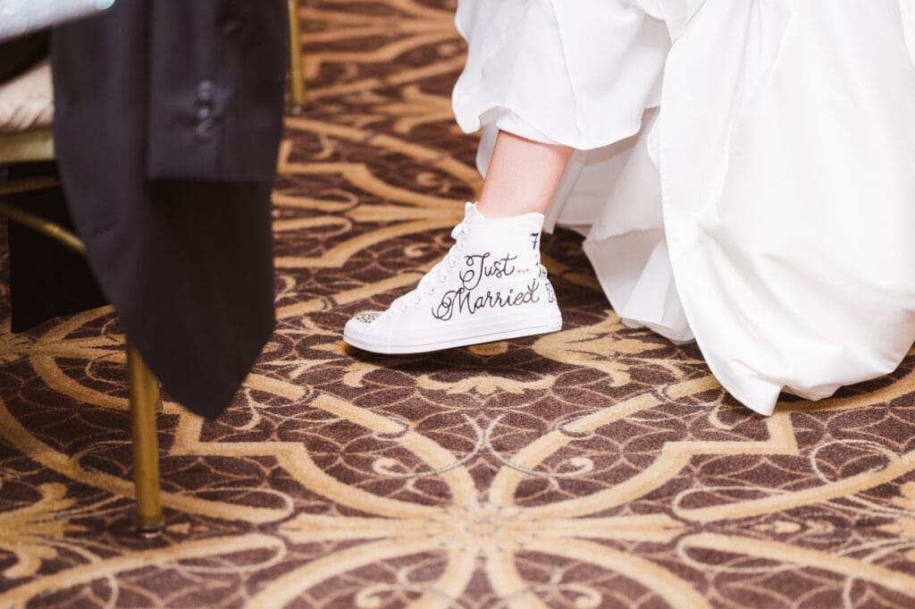 just-married-wedding-bride-converse-shoes