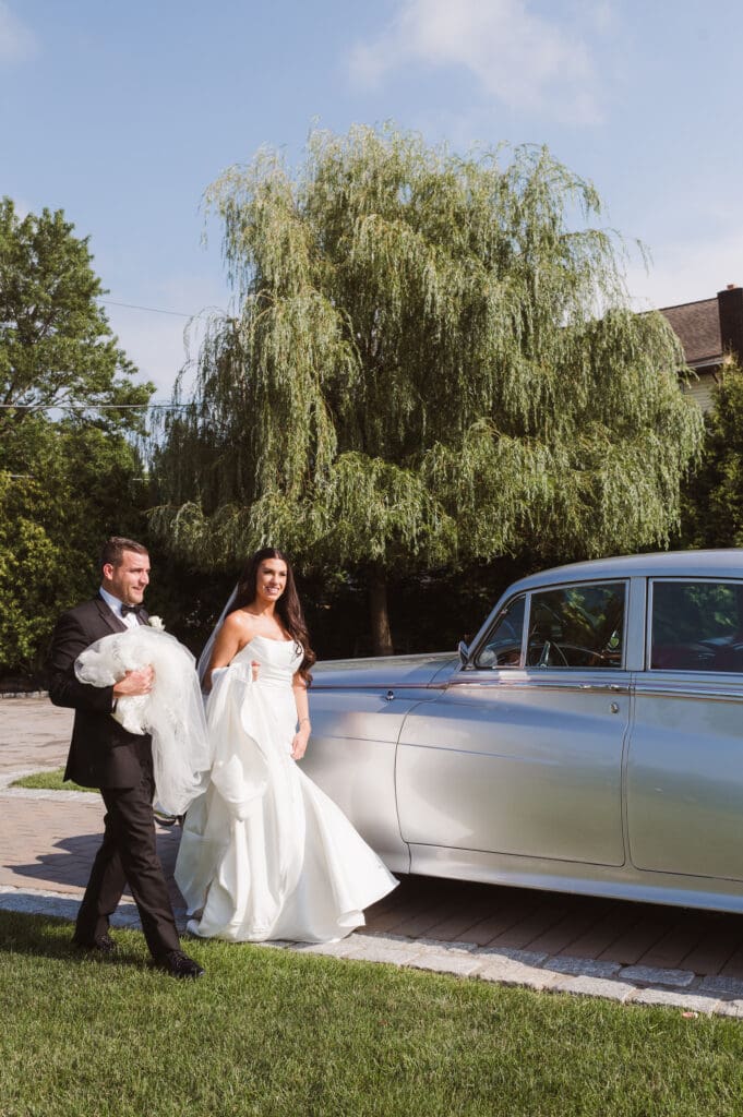 bride-and-groom-portrait-with-classic-rolls-royce-car
