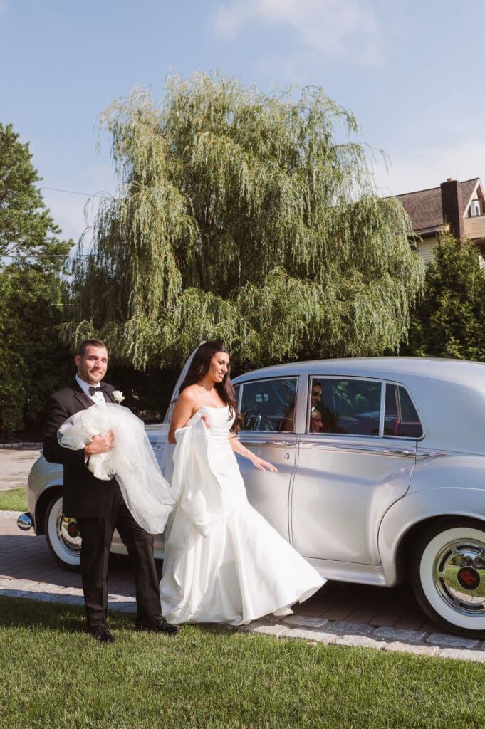 bride-and-groom-portrait-with-classic-rolls-royce-car