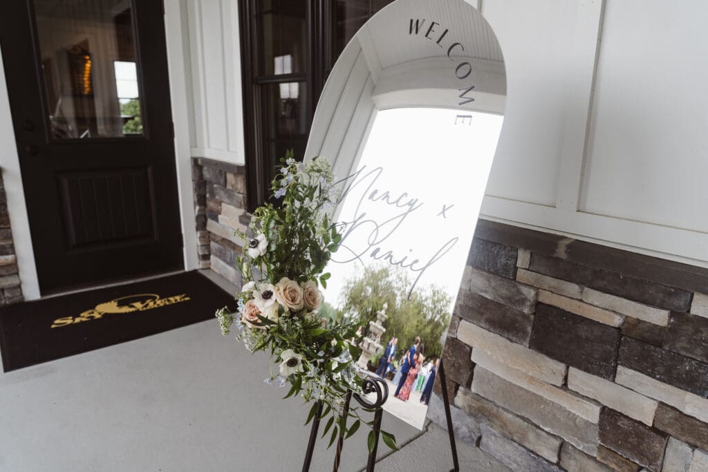 mirror-wedding-welcome-sign-with-flowers