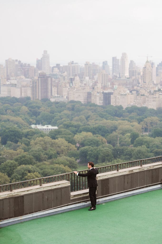 groom-central-park-nyc-view-from-apartment-rooftop