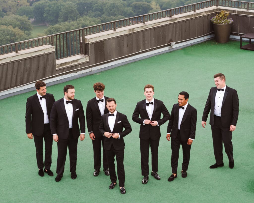 groomsmen-on-rooftop-candid