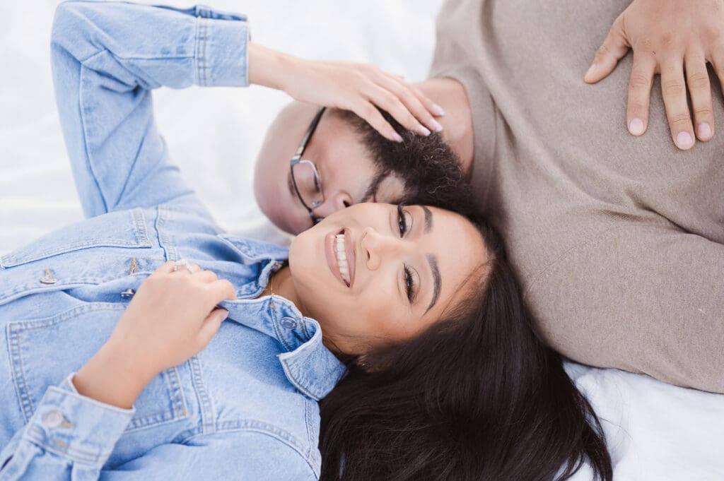 couple-engagement-photos-on-blanket-pose