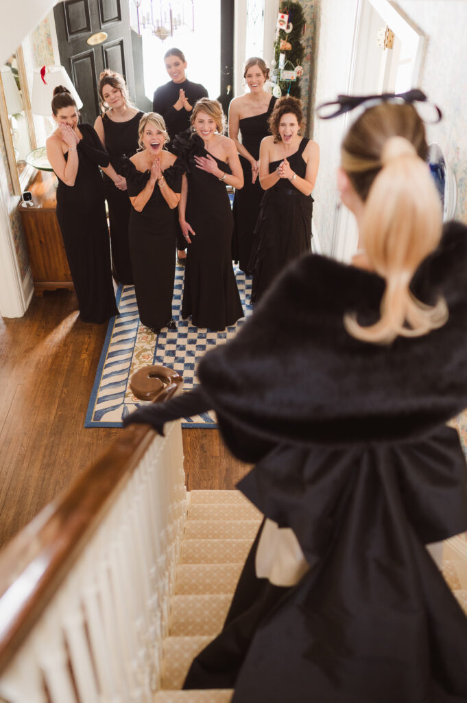 first-look-with-bridal-party-on-stairs
