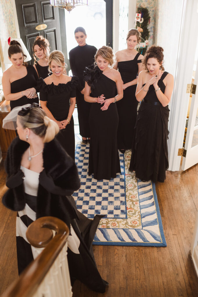 first-look-with-bridal-party-on-stairs