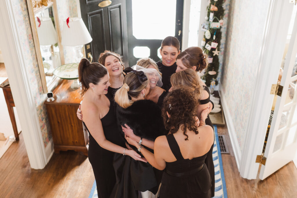 first-look-with-bridal-party-on-stairs