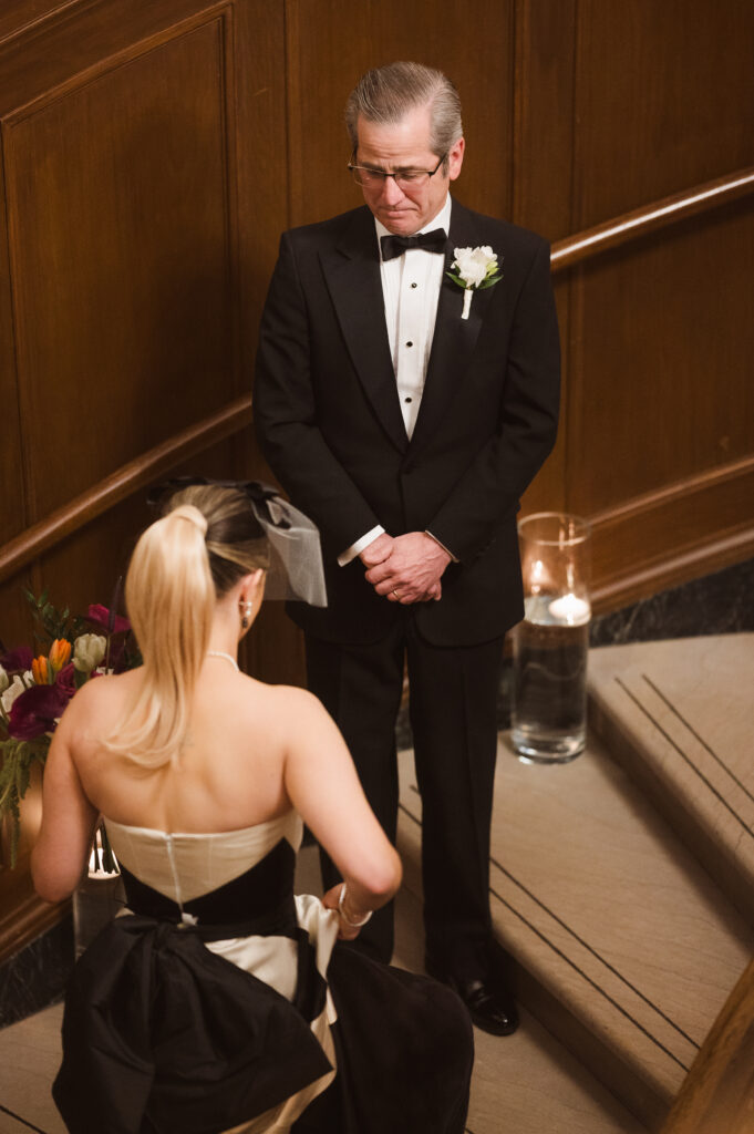bride-and-father-first-look-on-stairs