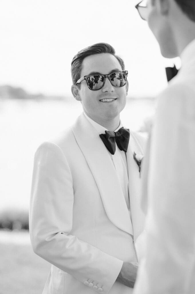 groom-looking-at-groom-sunglasses
