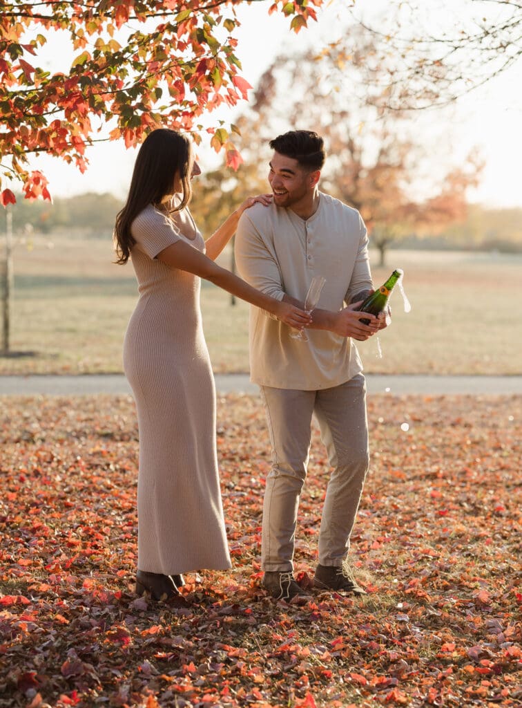 popping-champagne-fall-engagement-photos-in-liberty-state-park-by-suess-moments