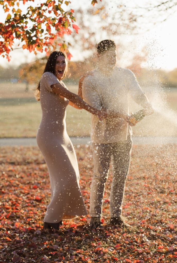 popping-champagne-fall-engagement-photos-in-liberty-state-park-by-suess-moments