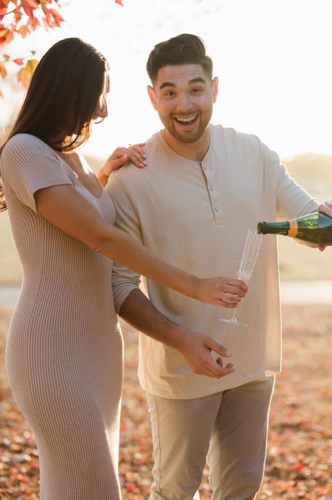 popping-champagne-fall-engagement-photos-in-liberty-state-park-by-suess-moments