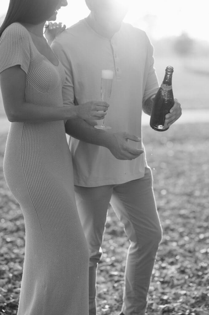 popping-champagne-fall-engagement-photos-in-liberty-state-park-by-suess-moments