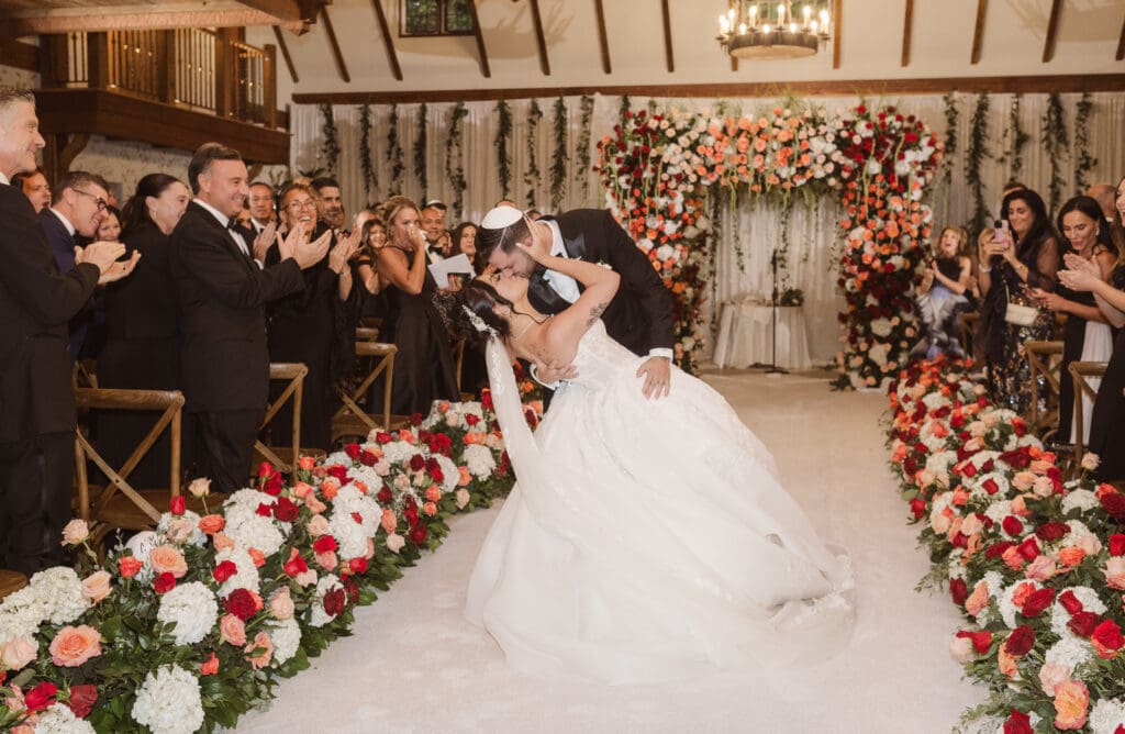 the-dip-kiss-ceremony-at-pleasantdale-chateau-nj-wedding-photos-by-photographer-suess-moments
