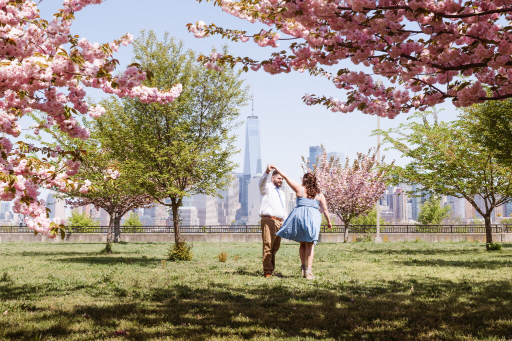 april-cherry-blossom-spring-engagement-photos-at-liberty-state-park-nj-by-suess-moments