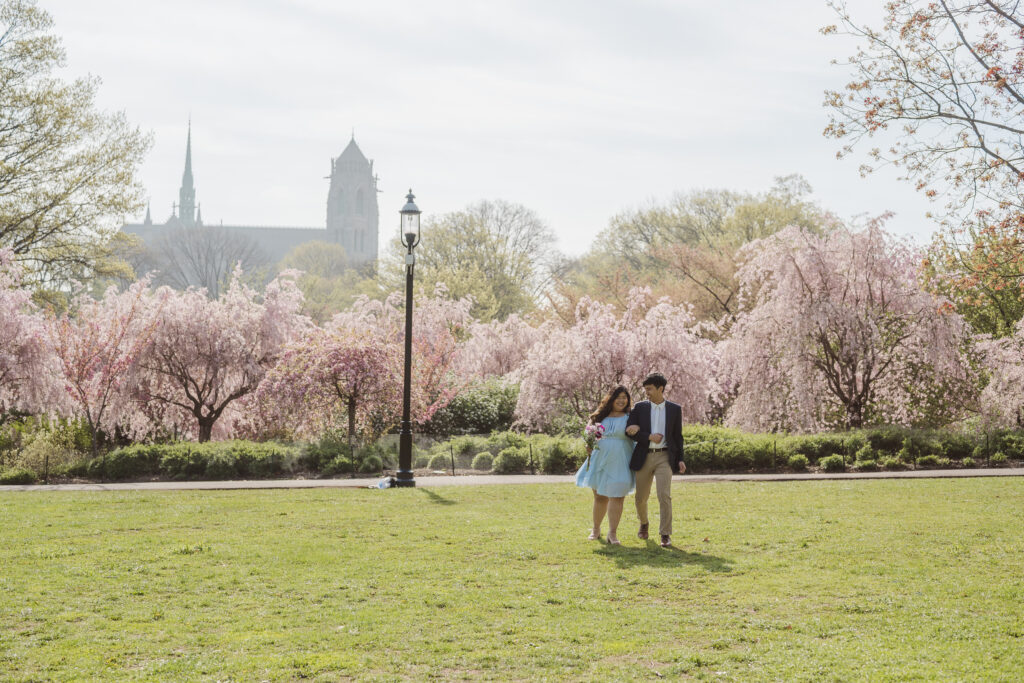 church and cherry blossom backdrop of couple at branch brook park nj